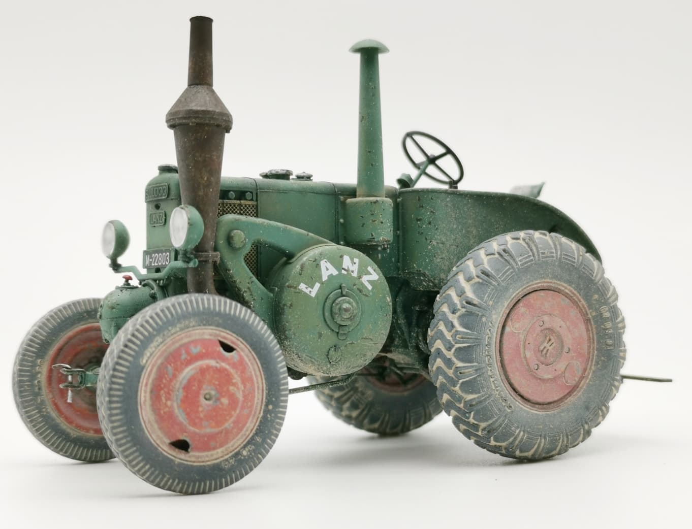 Lanz Bulldog tractor side view showing weathered green paint
